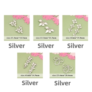 Detailed views of silver flower and leaf metal charms for jewelry making in various sizes