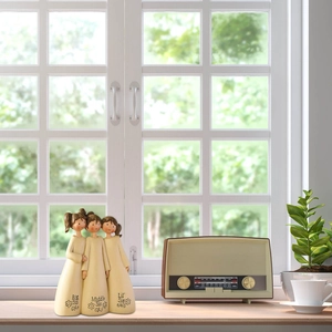 Detail showing three sisters resin figurine with Big Sis, Middle Sis and Lil Sis engraving