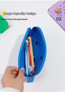 Close-up of blue silicone pencil case with hole design and large storage capacity