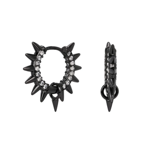 Macro detail of punk black hoop earring with silver rivets and white zircon stones
