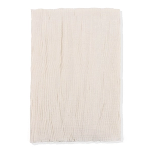 Detailed view of beige crinkled cotton scarf showing soft pleated fabric texture