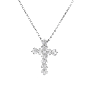 Macro detail of silver cross pendant with baguette-cut cubic zirconia in a radial setting