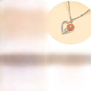 Detail view of heart sunflower pendant with 45+5cm chain length and 8g weight specs