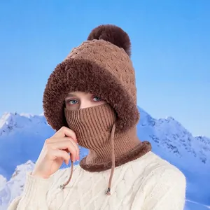 Women's brown winter knitted hat with neck warmer mask and fluffy pompom detail