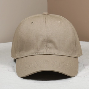 Detailed view of khaki cotton baseball cap with ventilation eyelets and curved brim