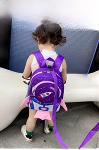 Detail of purple space rocket toddler backpack with safety leash and star patterns