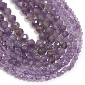 Macro shot of faceted natural amethyst beads showing deep purple crystal textures