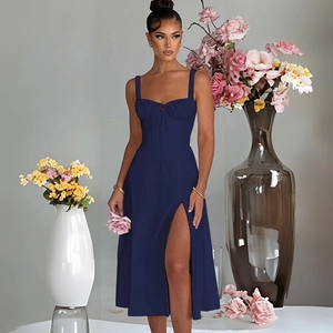 Detail of navy blue slim fit dress featuring ruched chest design and side slit hemline