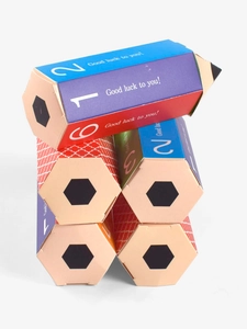 Colorful pencil-shaped paper gift boxes with 'Good luck' print and hexagonal structure