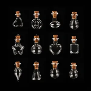 Collection of 12 small decorative glass bottles with cork stoppers in diverse creative shapes
