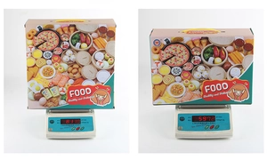 Detailed scale measurement showing weight of children's toy kitchen food set in packaging