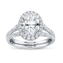 Macro detail of marquise halo engagement ring with split shank and diamond pave