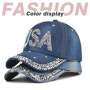 Detail of USA rhinestone pattern and diamond-studded brim on denim baseball caps