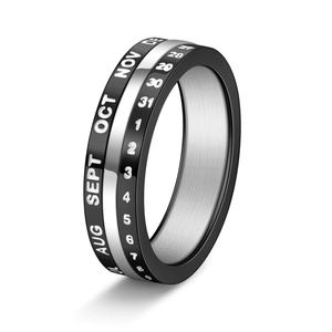 Rotating rose gold calendar ring in titanium steel featuring engraved dates and months
