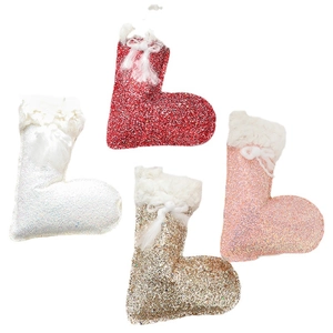 Set of four fabric Christmas stocking ornaments in red, white, gold and pink glitter