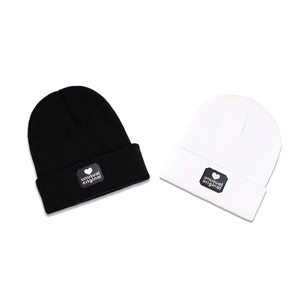 Unusual Original knit beanies in black and white with heart patch for winter warmth