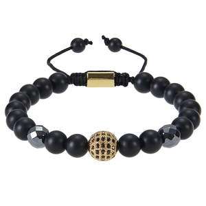 Detail of beaded bracelet with black matte stones and gold micro-pave zircon ball