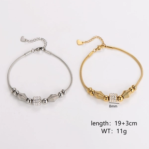 Gold and silver snake chain bracelets with diamond-encrusted beads and 8mm spiral charms