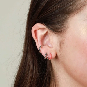 Minimalist 18k gold irregular wave ear cuff set with silver and pink studs on ear