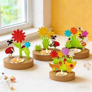 Detailed view of four wooden tea light holders with colorful cartoon insect and flower motifs