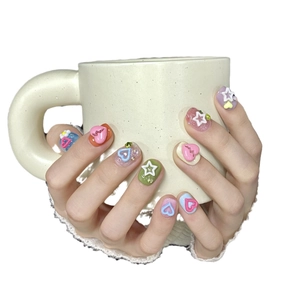 Y2K handmade press-on nails with 3D hearts and stars in vibrant candy colors