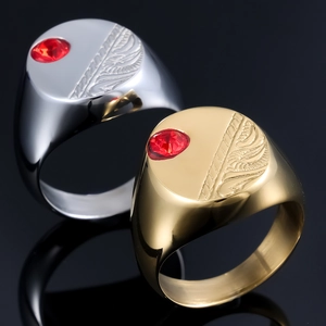Men's seal ring in gold and silver finish with red gemstone and leaf relief engraving