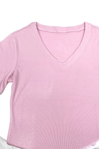 Close-up of pink V-neck T-shirt showing fine knit texture and neat neckline stitching