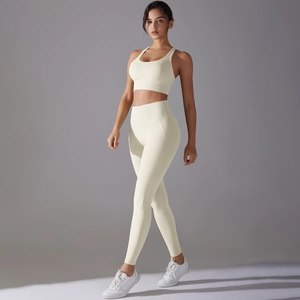 Close-up detail of cream white yoga set with high waist leggings and sports bra