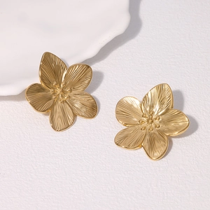 Vintage gold stainless steel flower stud earrings with a brushed metal texture