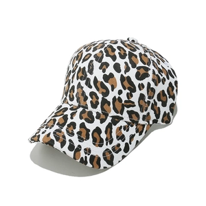 Detail of leopard print baseball cap featuring cotton canvas and curved brim structure