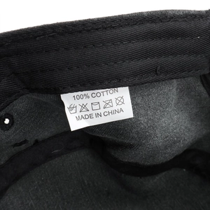 Detail view of the 100% cotton wash label and inner stitching of the vintage military cap