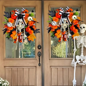 Halloween wreath with maple leaves, pumpkins, and skeleton on double wooden doors