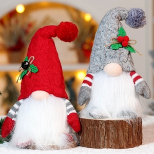 Close-up of lighted Christmas Gnomes with knitted hats and plush beards on wooden bases