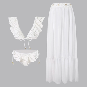 Detail of white crochet bikini with ruffles and matching sheer chiffon beach skirt set