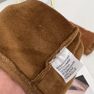 2-in-1 winter warm gloves with fleece lining and care label showing wool blend material