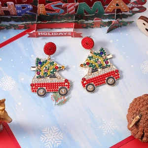Festive Christmas earrings featuring a vintage car carrying a tree with colorful beads
