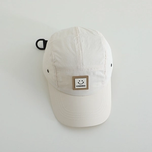 Breathable ivory kids camper hat featuring a kindness smiley patch and rear hook strap