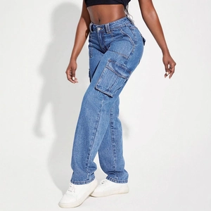Detail of high-waist blue denim cargo pants with large side pockets and relaxed straight cut