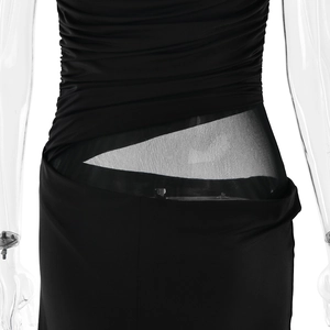 Detail shot of black sleeveless dress showing the mesh triangle patchwork at the waistline