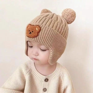 Cute khaki baby knitted hat with pom-pom ears and cartoon bear patch for winter warmth
