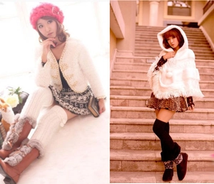 Close-up of white cable knit long leg warmers with fuzzy pom-poms for winter style