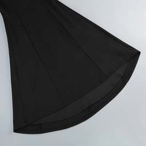 Detailed view of the black fishtail gown hem featuring premium heavy draping fabric