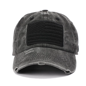 Macro detail of distressed washed cotton baseball cap with embroidered USA flag patch