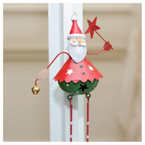 Detail of metal Santa Claus ornament with star cutouts and small festive bells