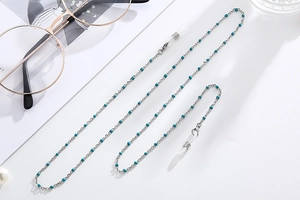 Detail of silver chain with turquoise beads and adjustable silicone loops for glasses