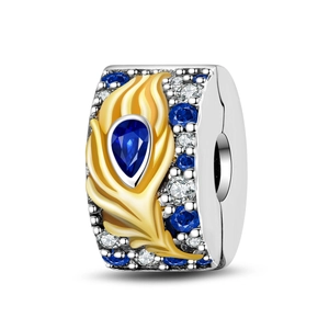 Detailed shot of silver bead with golden feather and inlaid blue and white zircon