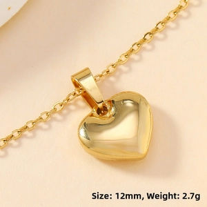 Polished gold heart pendant detail with 12mm size and 2.7g weight specifications