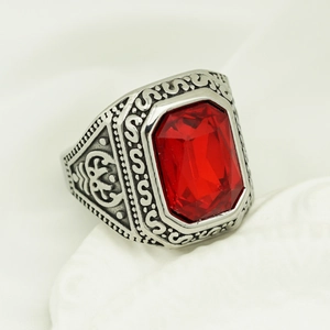 Close-up of vintage silver viking ring featuring a large red rectangle gemstone