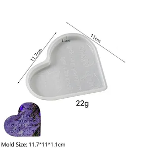 Macro view of heart-shaped silicone mold with engraved memorial quotes for resin DIY