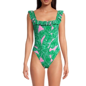 Pink one-piece swimsuit with green tropical leaf print and ruffled shoulder straps